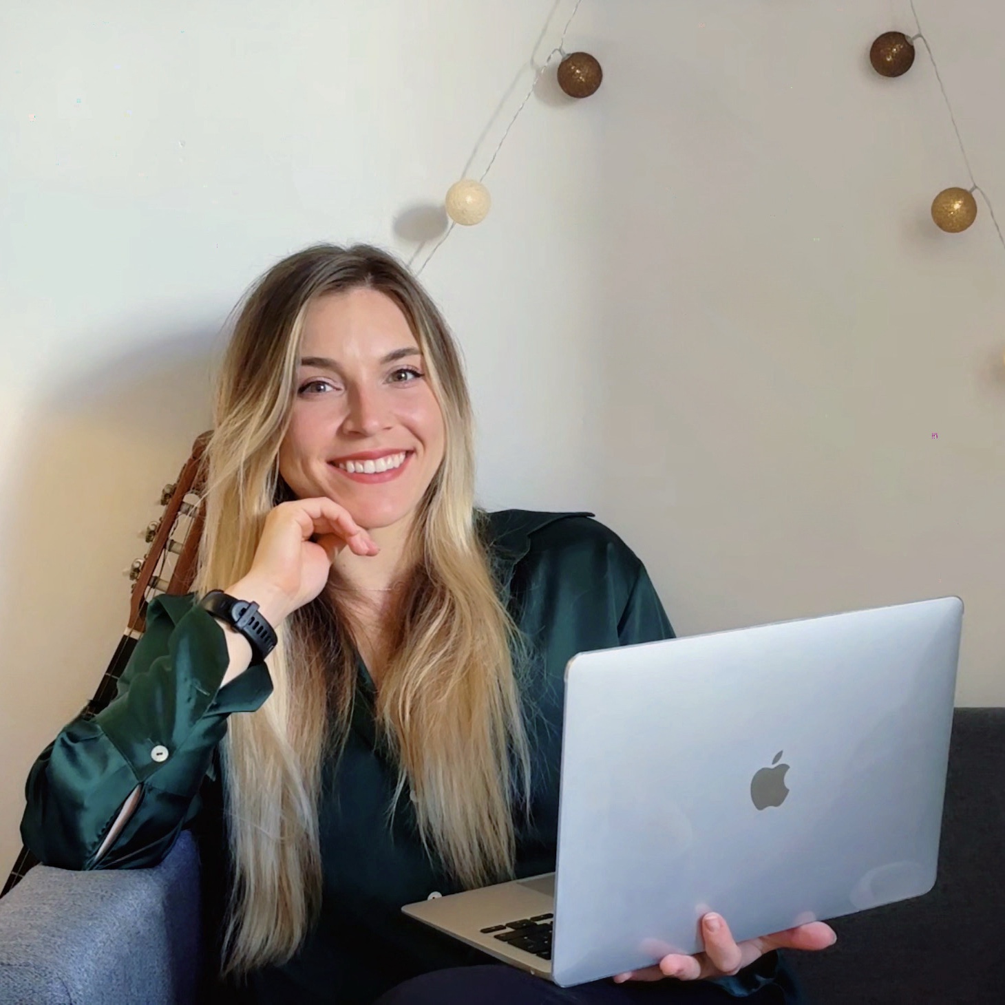 Joanna Slupek smiling with a laptop